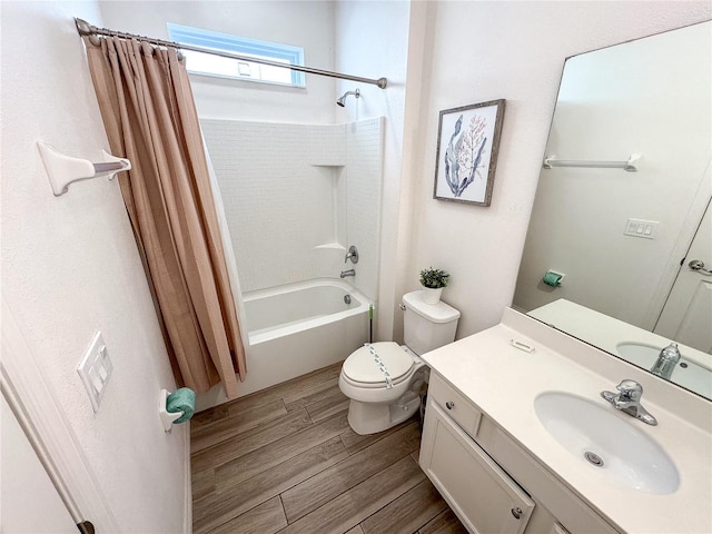 full bathroom featuring hardwood / wood-style flooring, shower / bath combo, vanity, and toilet