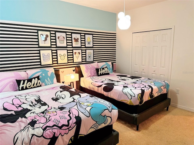 bedroom with light carpet and a closet