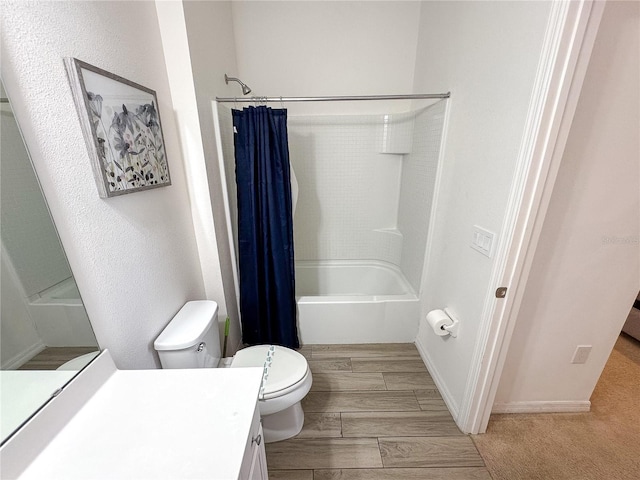 full bathroom featuring vanity, shower / bath combo, and toilet