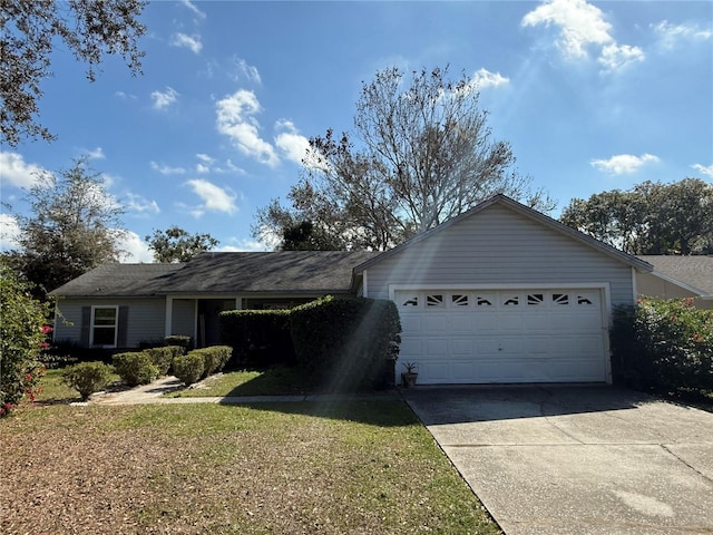 single story home featuring a garage and a front yard