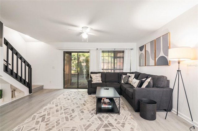 living room with hardwood / wood-style flooring and ceiling fan