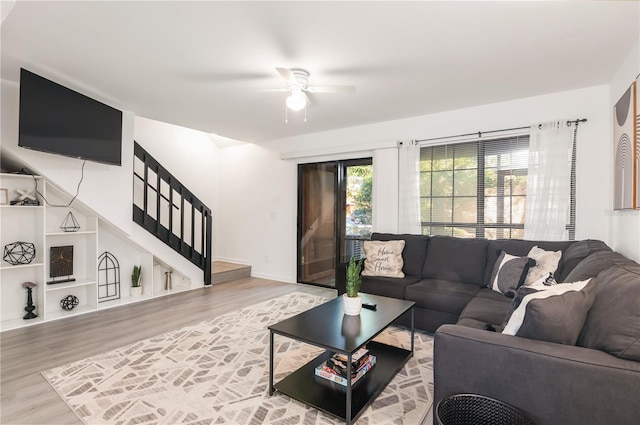 living room with ceiling fan and wood-type flooring