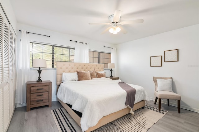 bedroom featuring a closet, ceiling fan, and light wood-type flooring