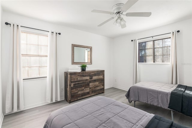 bedroom featuring ceiling fan and light hardwood / wood-style floors