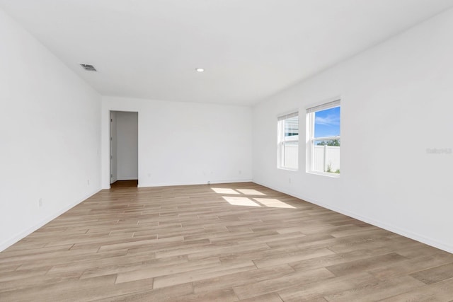 unfurnished room with light hardwood / wood-style flooring