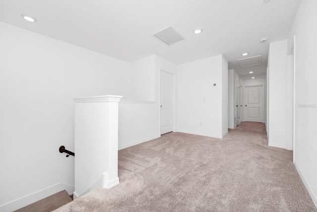 spare room with light colored carpet