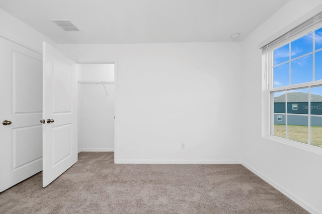 unfurnished bedroom with light carpet