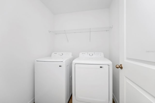 laundry room with washing machine and clothes dryer