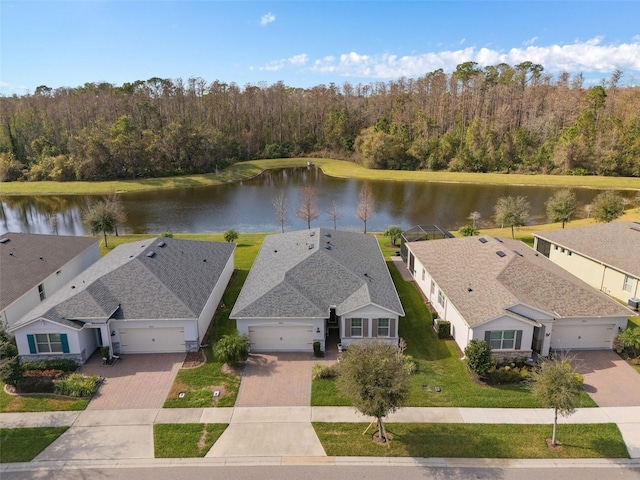 birds eye view of property with a water view