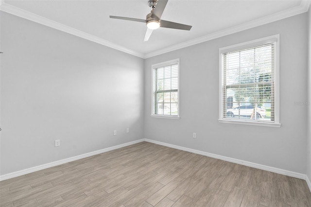 empty room with crown molding, ceiling fan, and light hardwood / wood-style floors