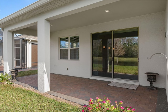 doorway to property featuring a patio