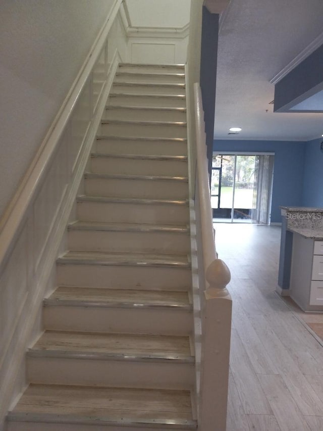 stairway featuring hardwood / wood-style flooring