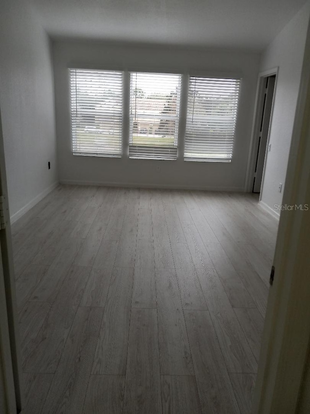 unfurnished room featuring light hardwood / wood-style flooring