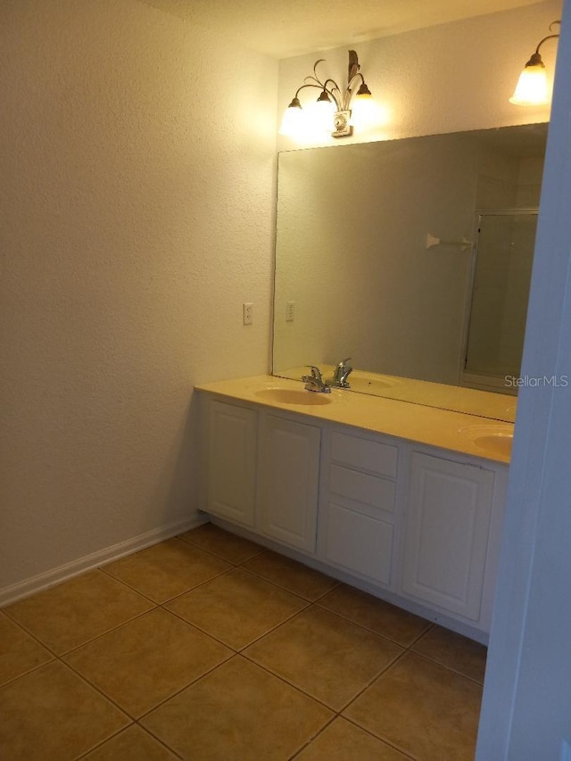 bathroom with vanity and tile patterned flooring