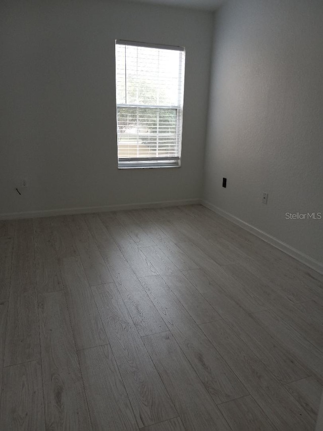 empty room featuring hardwood / wood-style floors