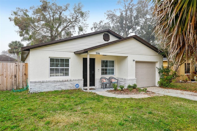 view of front of house with a garage and a front yard