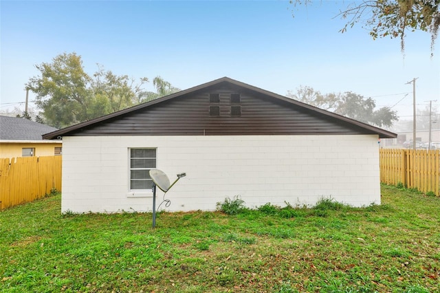 view of home's exterior featuring a yard