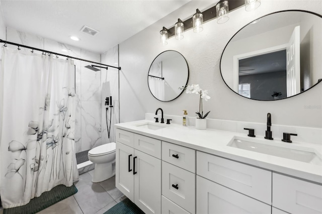 bathroom with vanity, a shower with curtain, tile patterned floors, and toilet