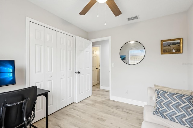 office featuring ceiling fan and light wood-type flooring