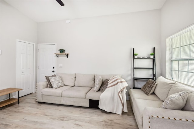 living room featuring ceiling fan and light wood-type flooring