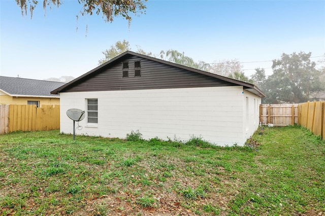 view of home's exterior featuring a yard