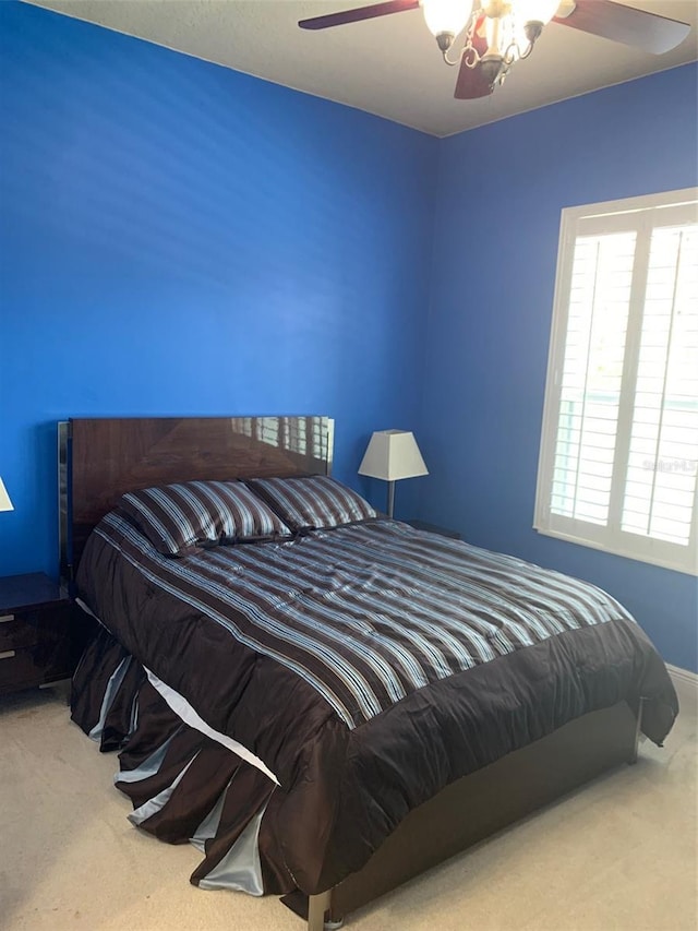 bedroom featuring carpet floors and ceiling fan