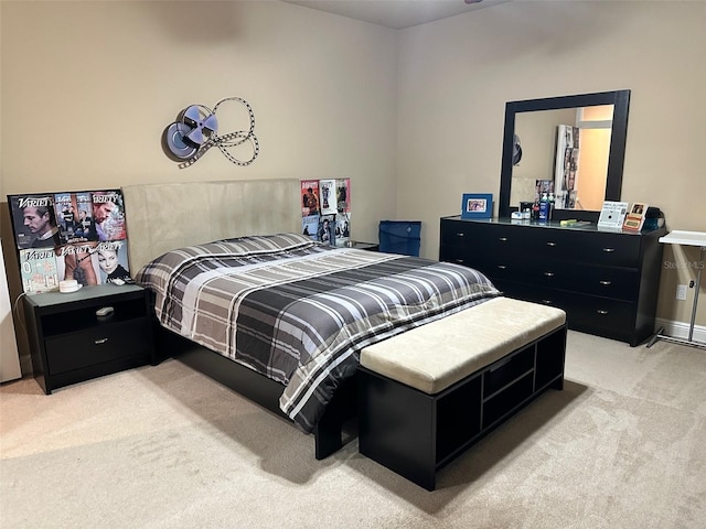 bedroom featuring light carpet