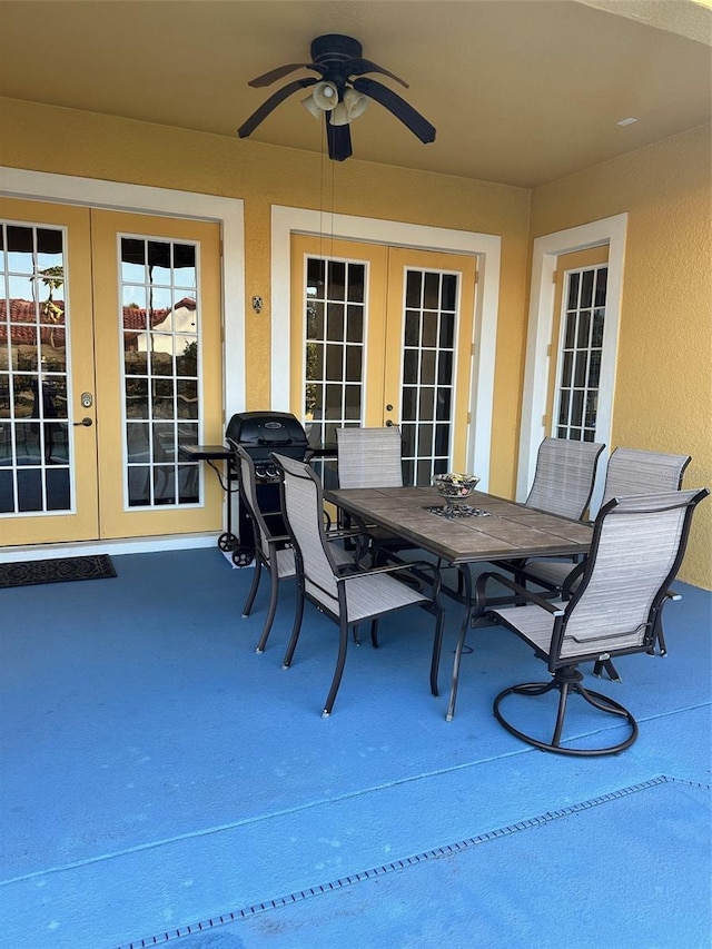 view of patio / terrace with outdoor dining space, french doors, and ceiling fan