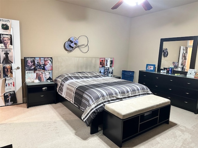bedroom with ceiling fan and light carpet