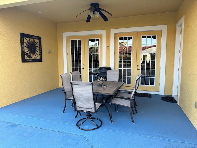 view of patio featuring french doors, outdoor dining area, and a ceiling fan