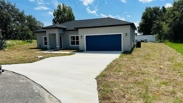 11 Spruce Ln, Ocala, FL 34472 - view of front of property featuring concrete driveway, stucco siding, an attached garage, a front yard, and roof with shingles