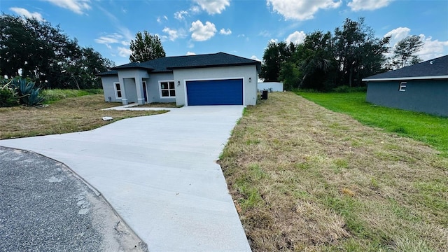 11 Spruce Ln, Ocala, FL 34472 - view of front of house with driveway, stucco siding, an attached garage, and a front lawn