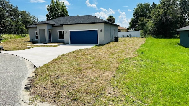 11 Spruce Ln, Ocala, FL 34472 - view of front of property featuring stucco siding, concrete driveway, a garage, and a shingled roof