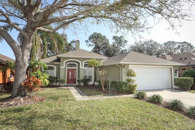 single story home with a garage and a front lawn