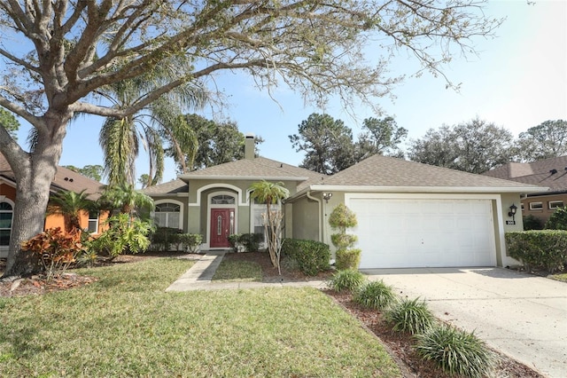 ranch-style house featuring a garage and a front lawn