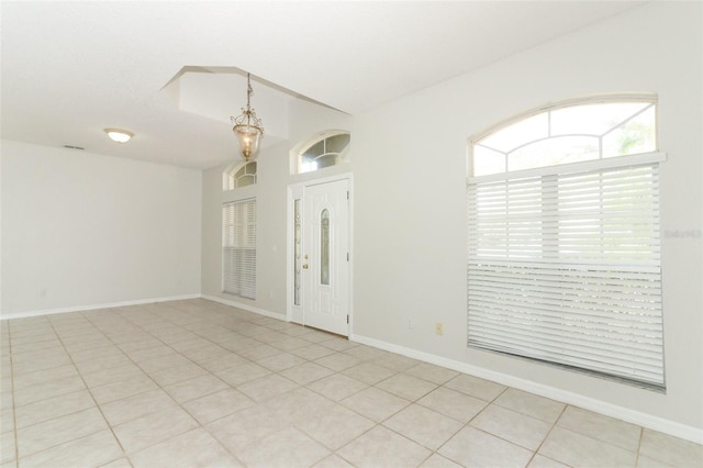 foyer entrance with light tile patterned flooring