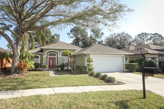 ranch-style house featuring a garage and a front yard