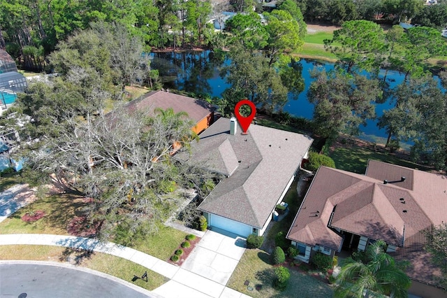 birds eye view of property with a water view