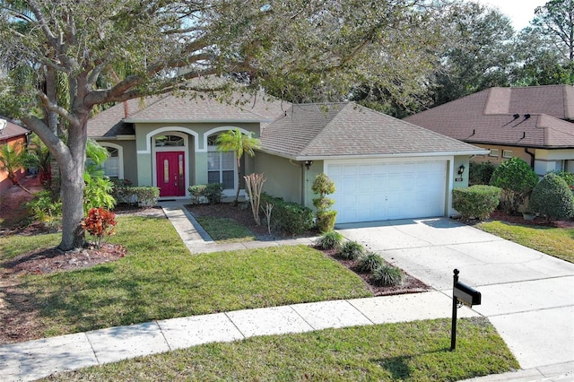 single story home with a garage and a front lawn