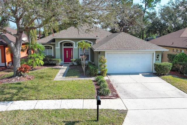 single story home featuring a garage and a front yard