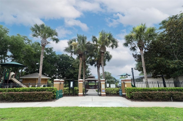 view of home's community with a yard and a playground