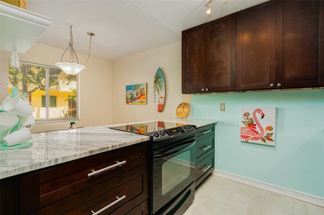 kitchen with light stone countertops, decorative light fixtures, dark brown cabinets, and black / electric stove