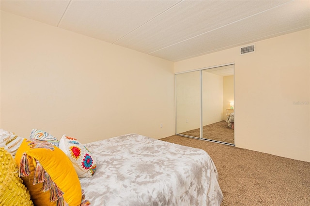 carpeted bedroom with a closet