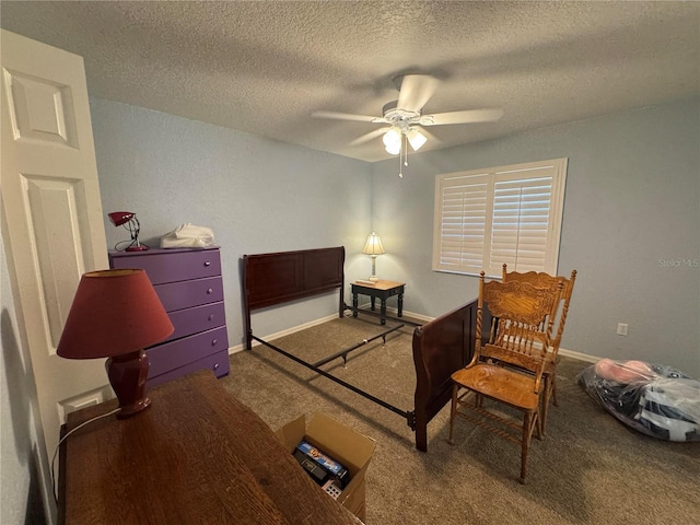 carpeted bedroom with ceiling fan and a textured ceiling