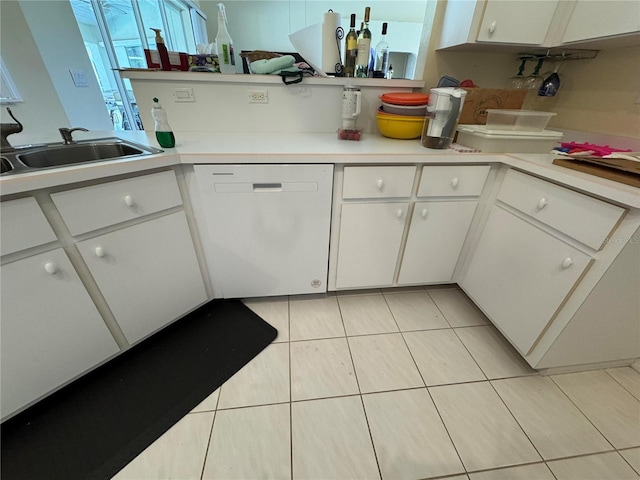 kitchen featuring white cabinetry, sink, and dishwasher