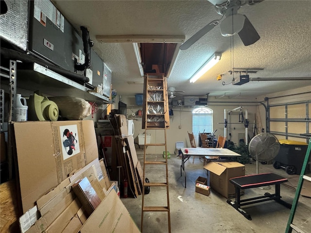 garage featuring ceiling fan and a garage door opener