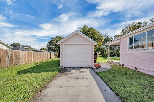 garage featuring a yard