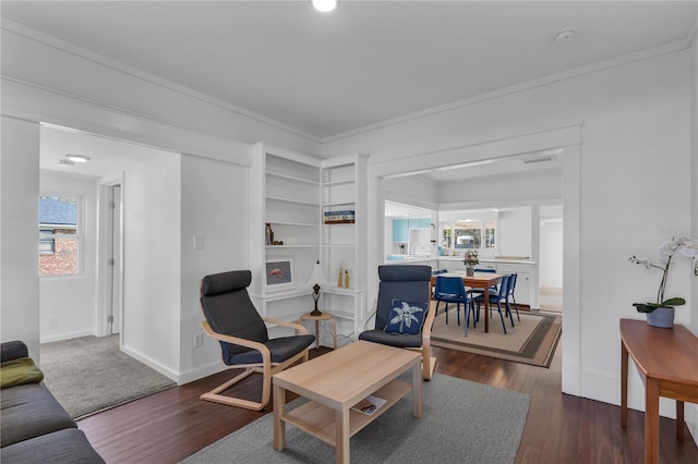 living room with ornamental molding and dark hardwood / wood-style flooring