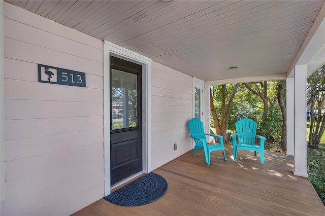 wooden terrace featuring a porch