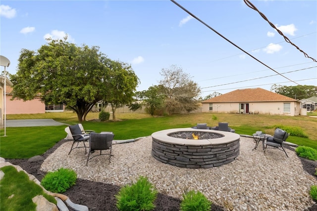 view of yard with a patio area and an outdoor fire pit